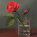 Red Rose and Bud in a Tumbler on a Shiny Table